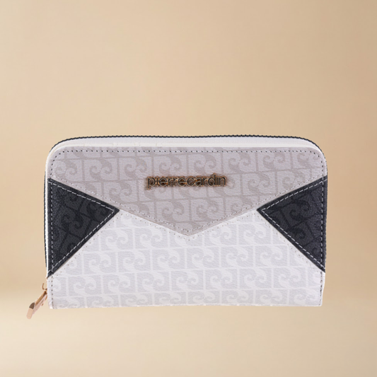 White and black wallet with geometric pattern on beige background