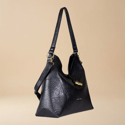 Pierre Cardin black spacious pebbled leather shoulder bag with gold-tone hardware and a small gold logo on the front- Skai Skai Malta