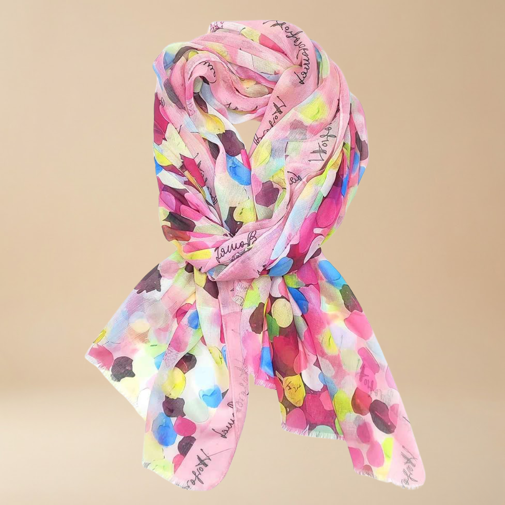 Colorful scarf with dot pattern on a beige background